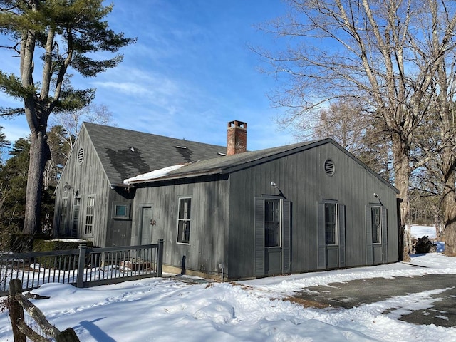 view of snow covered house