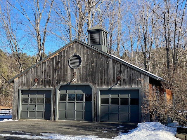 view of snow covered garage