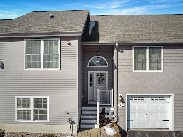 entrance to property featuring a garage