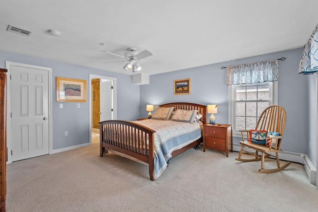 carpeted bedroom with ceiling fan and ensuite bathroom