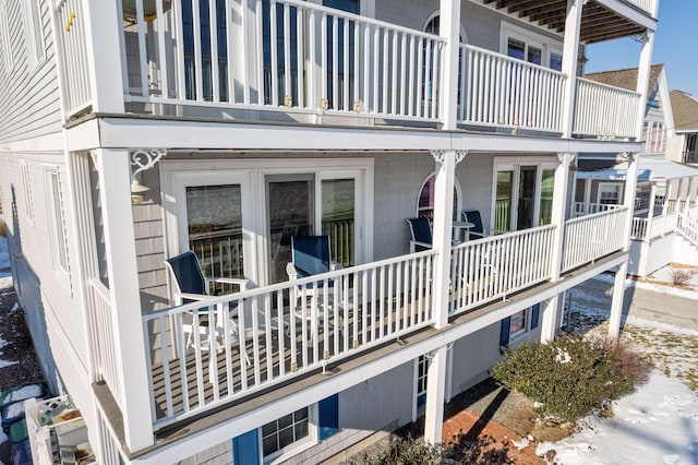 rear view of property featuring a balcony