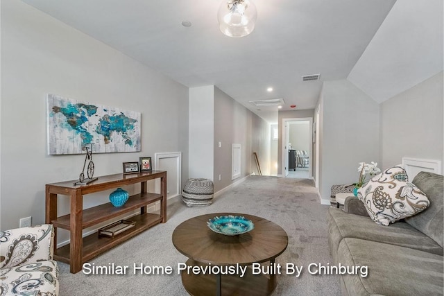 living room featuring vaulted ceiling and carpet