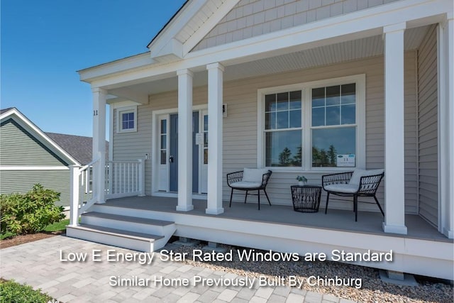 view of exterior entry with a porch