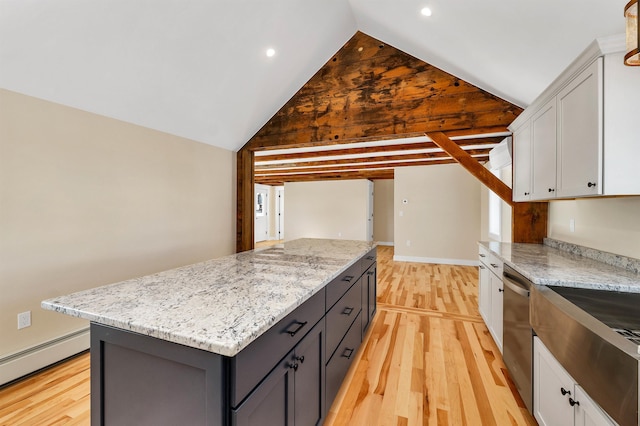95 Plymouth St, Meredith, NH 03253 - kitchen with a baseboard radiator, light wood finished floors, a kitchen island, white cabinets, and stainless steel dishwasher
