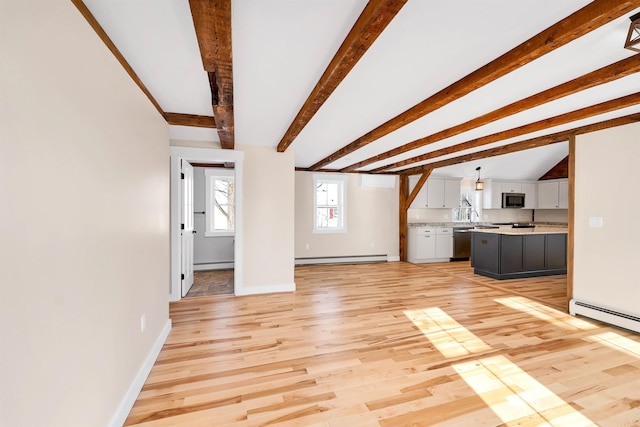 95 Plymouth St, Meredith, NH 03253 - unfurnished living room with a baseboard radiator, baseboards, light wood-type flooring, and beam ceiling