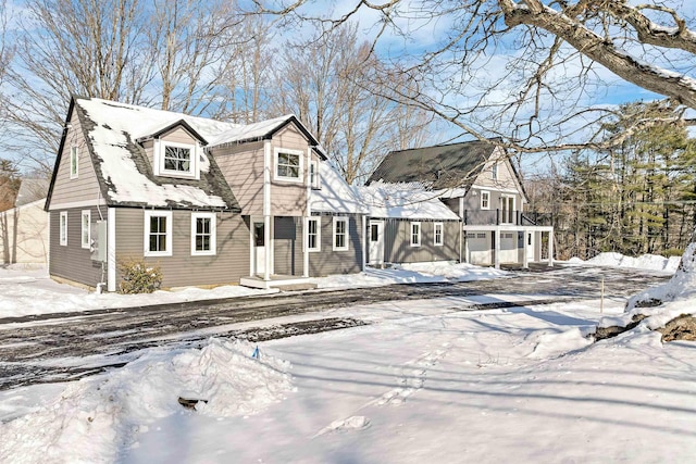 cape cod-style house with a garage