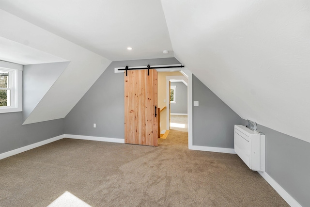95 Plymouth St, Meredith, NH 03253 - bonus room with carpet flooring, vaulted ceiling, baseboards, a barn door, and recessed lighting