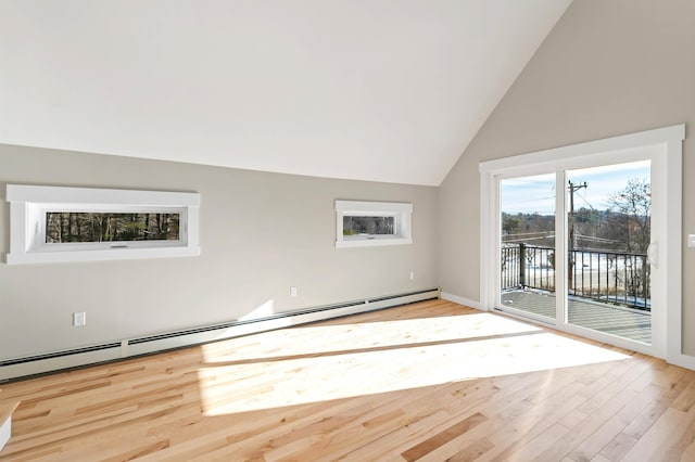 95 Plymouth St, Meredith, NH 03253 - unfurnished living room featuring a baseboard heating unit, wood finished floors, lofted ceiling, and baseboards