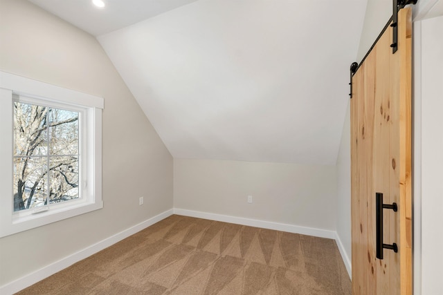 95 Plymouth St, Meredith, NH 03253 - bonus room with a barn door, lofted ceiling, light colored carpet, baseboards, and recessed lighting