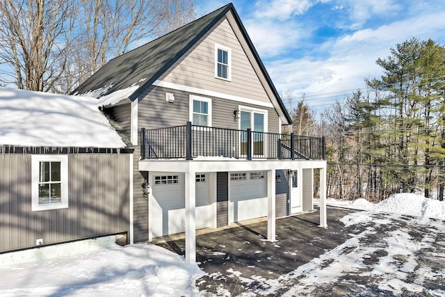 95 Plymouth St, Meredith, NH 03253 - view of front of property featuring a balcony and an attached garage