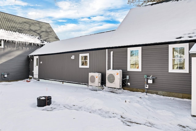 95 Plymouth St, Meredith, NH 03253 - snow covered house with ac unit