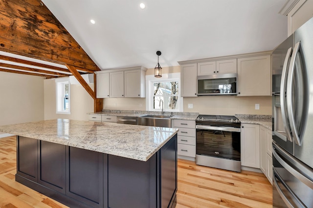 95 Plymouth St, Meredith, NH 03253 - kitchen with stainless steel appliances, a sink, plenty of natural light, light wood finished floors, and recessed lighting