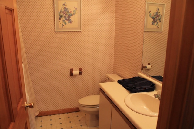 bathroom with vanity and toilet