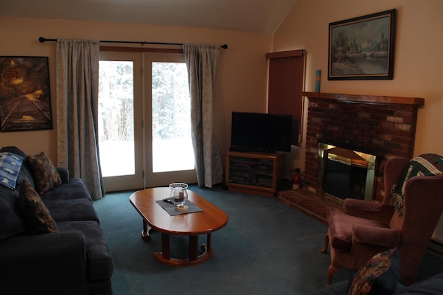 living room featuring lofted ceiling, a brick fireplace, and carpet flooring