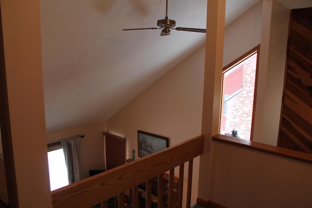 stairway featuring vaulted ceiling