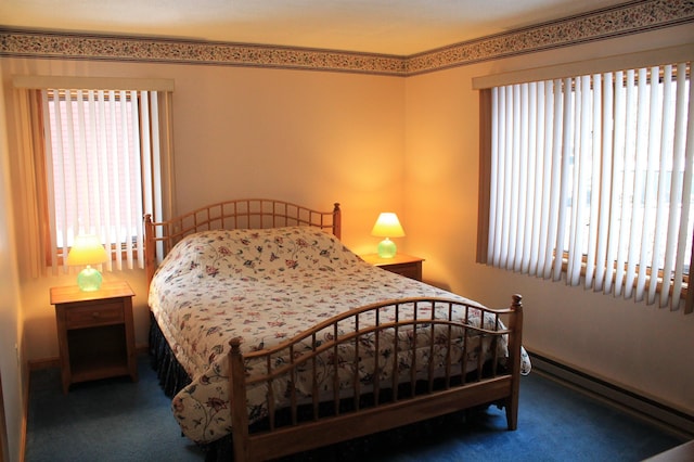 carpeted bedroom with baseboard heating