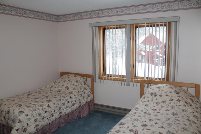 carpeted bedroom with a baseboard radiator