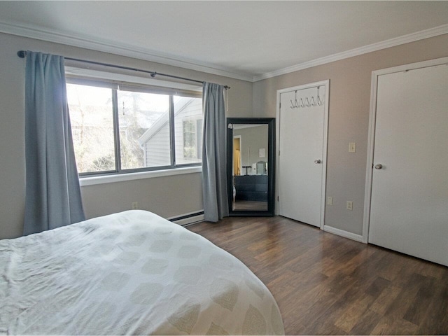 bedroom with crown molding, dark wood-type flooring, and baseboard heating