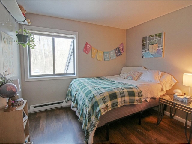 bedroom featuring baseboard heating and dark wood-type flooring