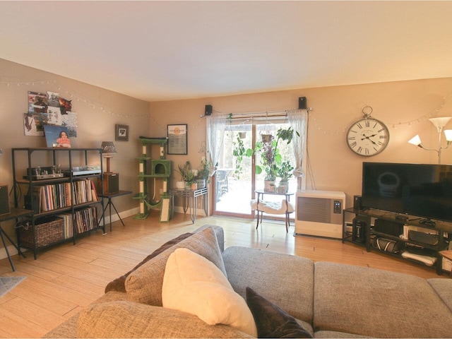 living room featuring light hardwood / wood-style floors and heating unit