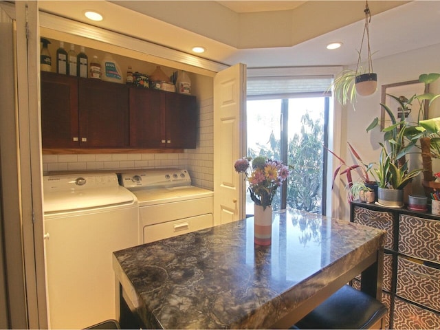 interior space with cabinets and independent washer and dryer