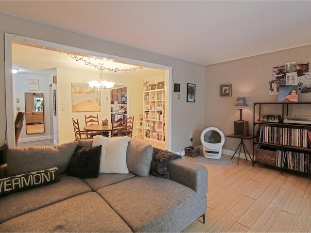 living room featuring a chandelier and hardwood / wood-style floors