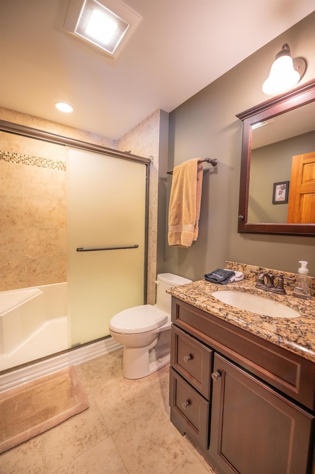 bathroom featuring walk in shower, vanity, and toilet