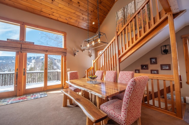 dining room featuring wood ceiling, a mountain view, high vaulted ceiling, and carpet