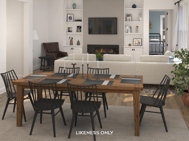 dining room featuring hardwood / wood-style flooring and built in shelves