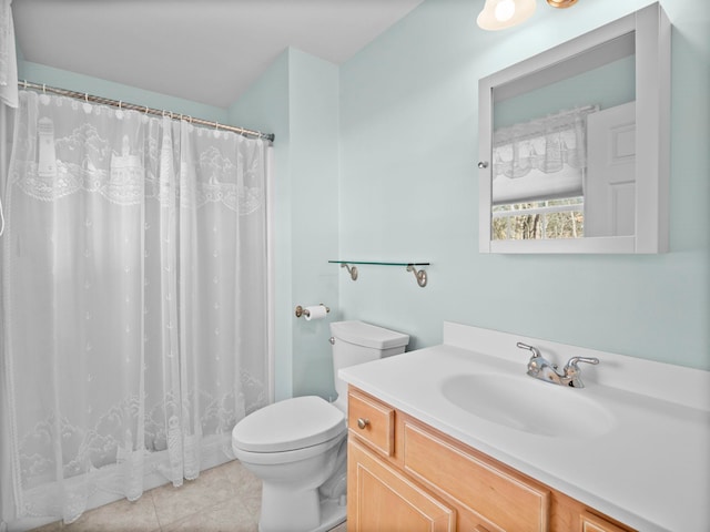 bathroom with vanity, curtained shower, tile patterned floors, and toilet