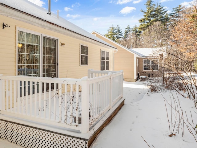 view of snow covered exterior featuring a deck