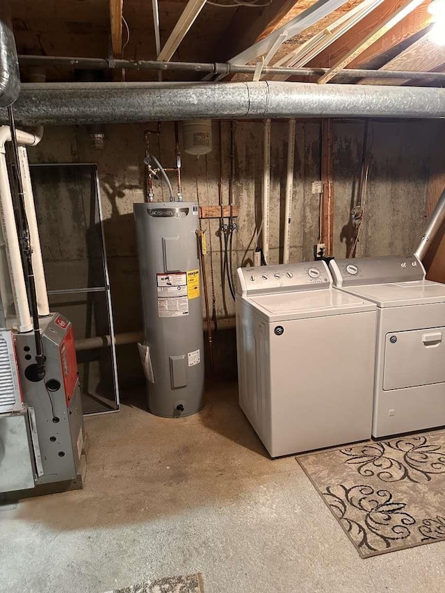 washroom with water heater and independent washer and dryer