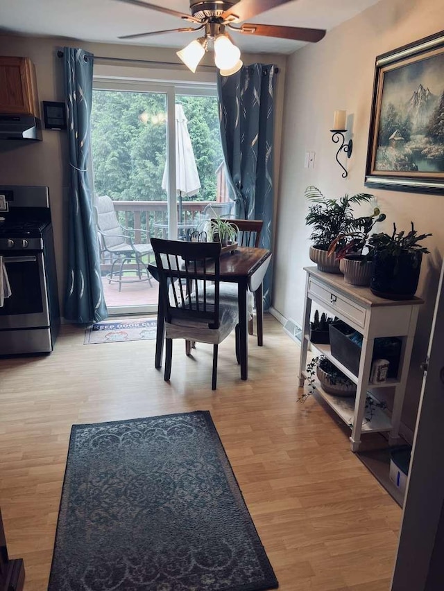 dining space featuring ceiling fan and light hardwood / wood-style flooring