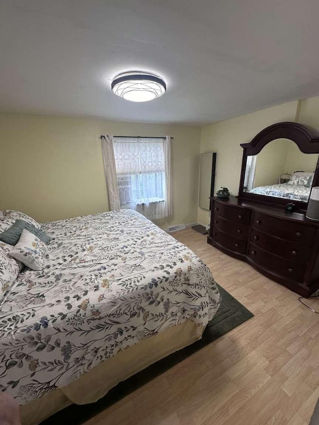 bedroom with light hardwood / wood-style floors