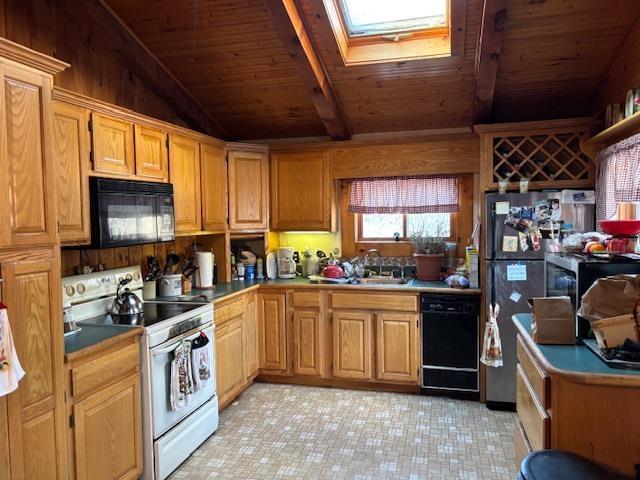 kitchen with wood ceiling, vaulted ceiling with skylight, sink, and black appliances