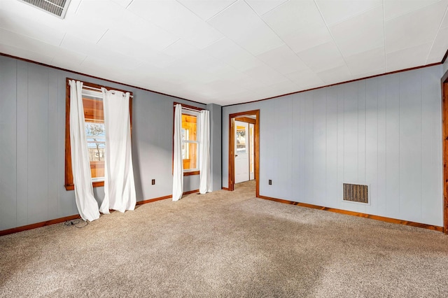 carpeted empty room with ornamental molding