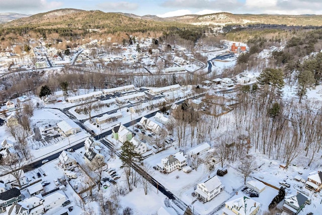 snowy aerial view featuring a mountain view