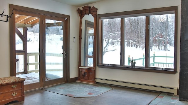 entryway featuring baseboard heating and wood-type flooring