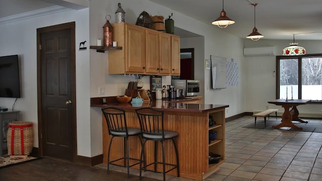 kitchen featuring an AC wall unit, a breakfast bar area, hanging light fixtures, ornamental molding, and kitchen peninsula