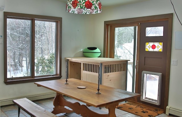 dining room featuring a baseboard heating unit