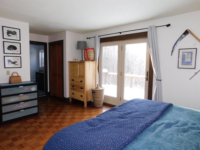 bedroom with dark parquet floors