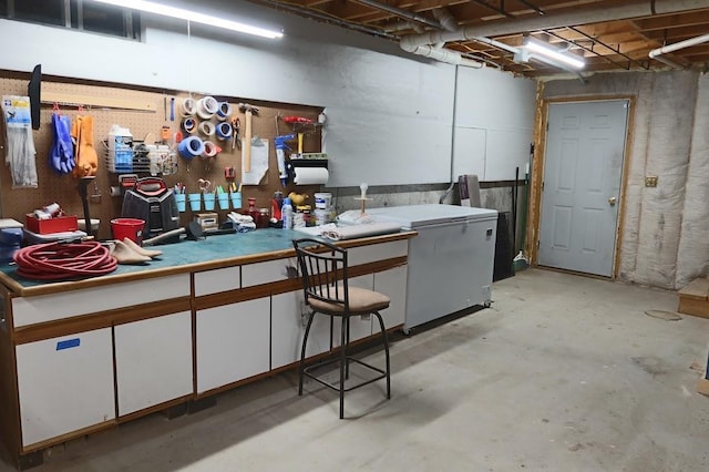 basement featuring fridge