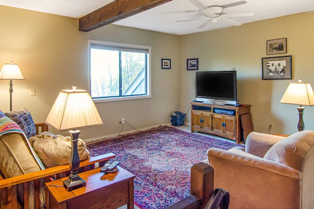 living room with beam ceiling and ceiling fan