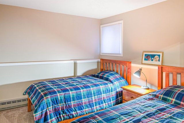 carpeted bedroom with baseboard heating