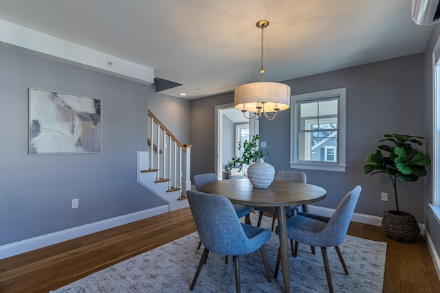 dining area with dark hardwood / wood-style floors