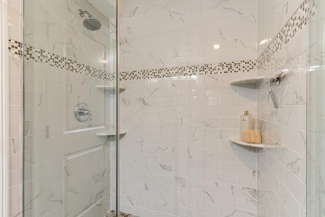 bathroom with tiled shower