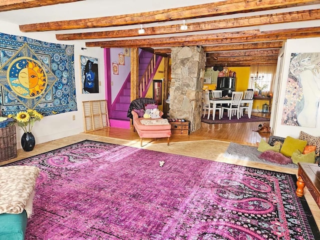 interior space with hardwood / wood-style floors and beamed ceiling