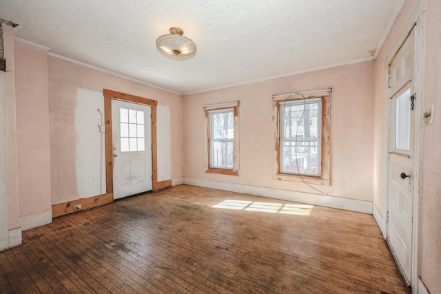 interior space with crown molding and dark hardwood / wood-style floors