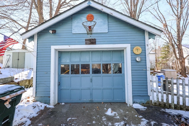 view of snow covered garage