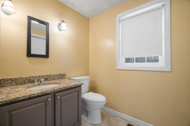 bathroom with vanity, tile patterned floors, and toilet